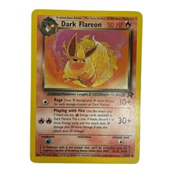 Collection of mainly vintage Pokemon cards including Charizard Base Set Holographic number 4/102 and two Ancient Mew 2000 promo cards, some housed within plastic wallets and some loose