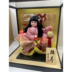 Japanese doll, dressed in traditional Japanese dress, within wooden glazed box, box H40cm