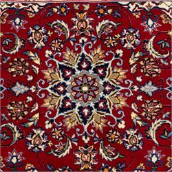 Two Central Persian rugs, ivory ground with a symmetrical foliate and floral design around a shaped cartouche medallion with a red floral and bird motif border with contrasting guard stripes, 142x76cm, Central Persian Kashan rug, crimson central field with a floral and foliate design with a stylized rosette medallion incorporating palmettes and scrolling vine work, enclosed by a dark navy border and multiple guard stripes, 117x68cm, (2)