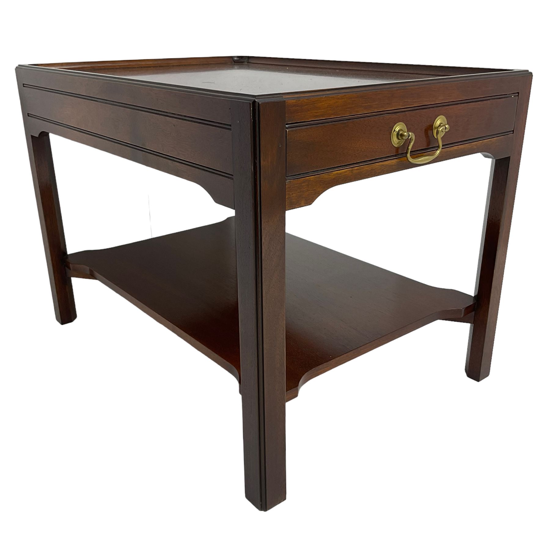 Mahogany side table or end table, the dished rectangular top with moulded edge, fitted with single end drawer, moulded square supports with inner chamfer united by under-tier 