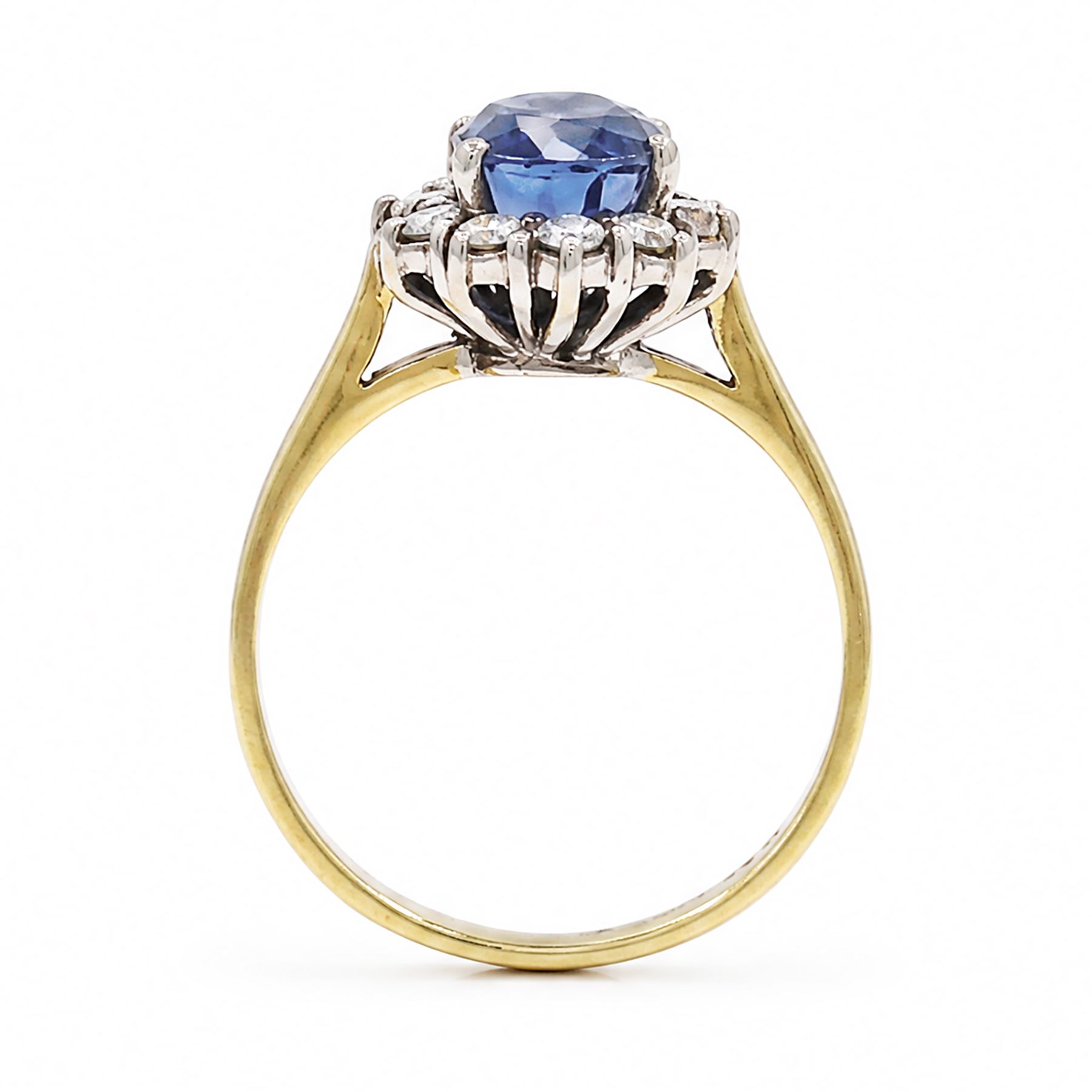 18ct gold sapphire and diamond cluster ring, oval cut sapphire of approx 1.50 carat, surrounded by ten round brilliant cut diamonds, Birmingham import mark 1981, total diamond weight approx 0.30 carat