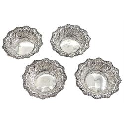 Set of four Victorian silver bon bon dishes, of circular form, with shaped rim and embossed foliate scroll decoration, hallmarked R H Halford & Sons, London 1896, approximate total weight 3.34 ozt (103.8 grams)