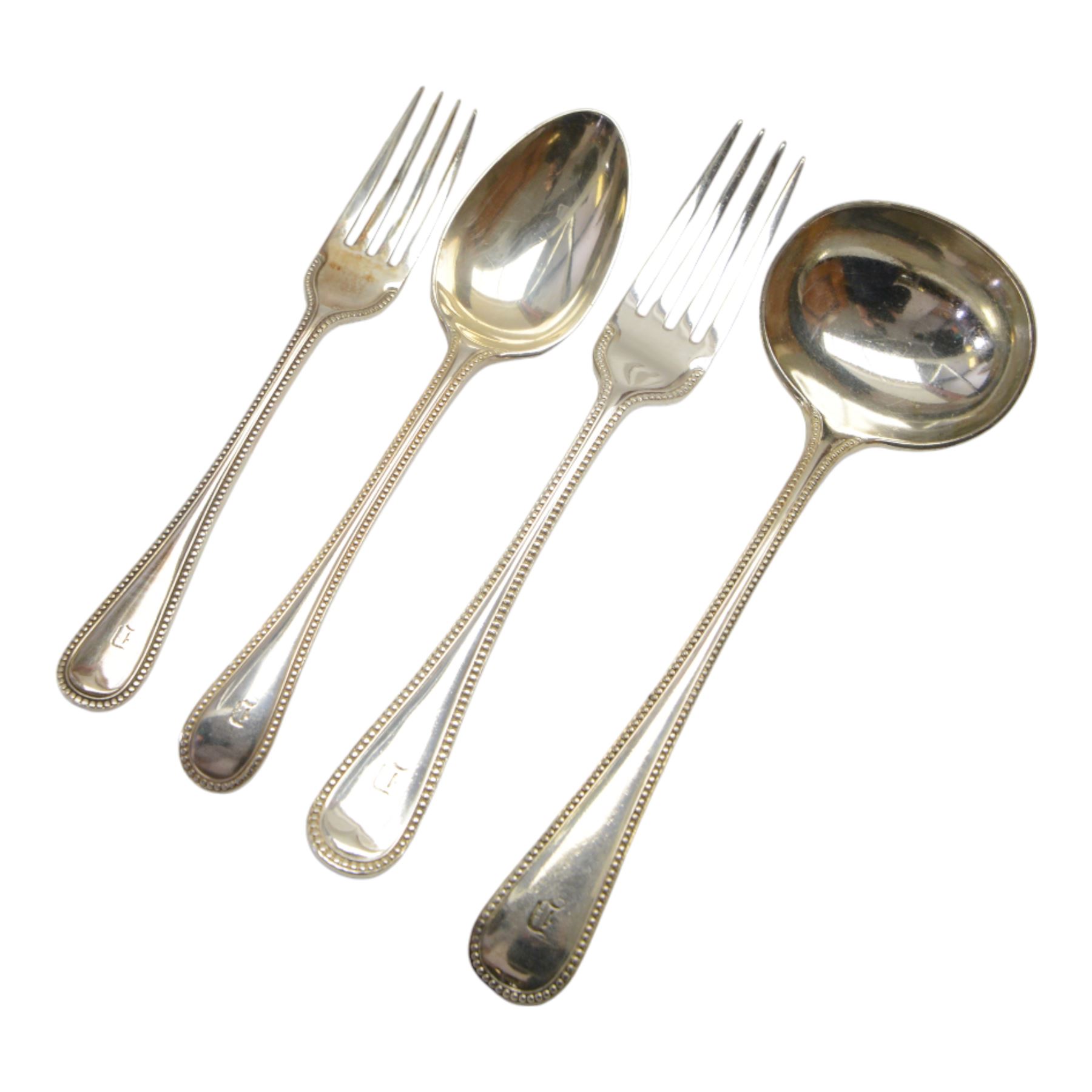 Oak table top canteen cabinet, the top with inset vacant brass cartouche, with pair of panelled doors opening to reveal four interior drawers with inset brass handle, containing a selection of silver plated flatware, 29cm x 40cm x 51cm