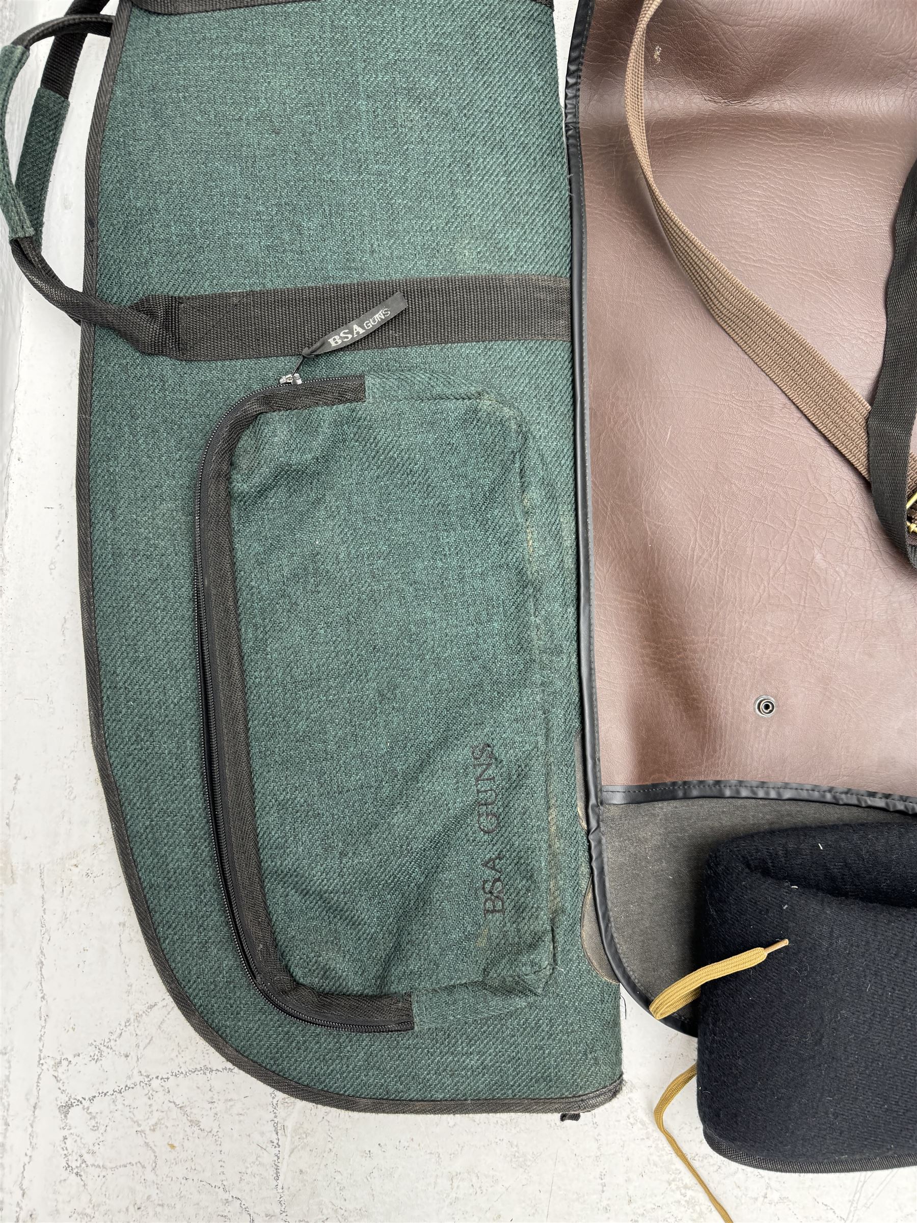 Collection of gun slips, including BSA guns and napier examples and leather 12-bore cartridge belt 