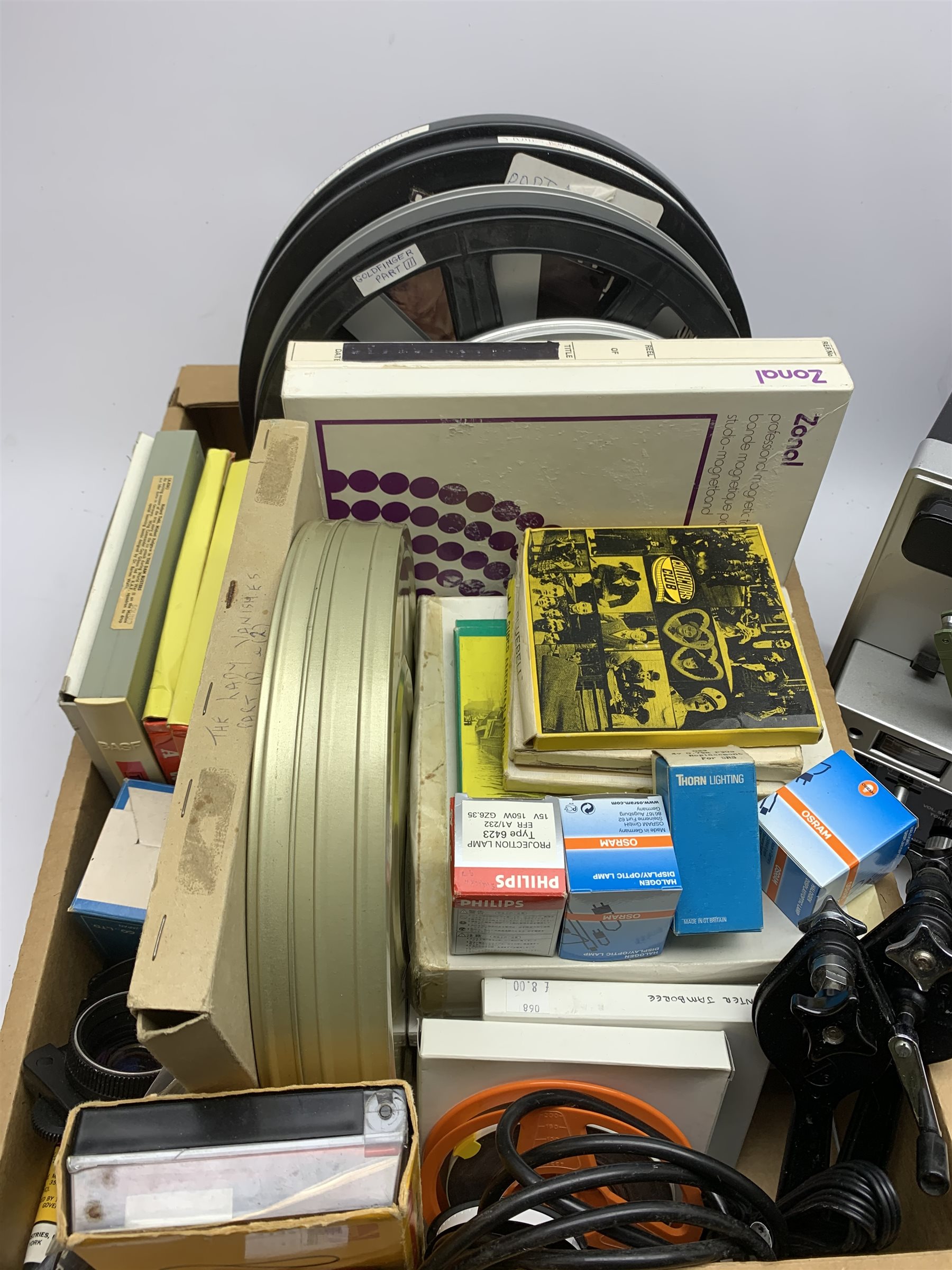 Two 'ELMO Sound ST-1200D' super 8 sound projectors, one in a carry case with photocopy of the original instruction manual, together with various film reels, spare bulbs and other accessories