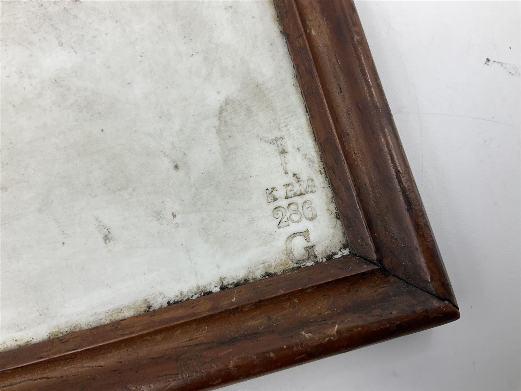 KPM Berlin lithophane panel, of two angels supporting a female figure to the centre, encased in a rosewood frame and handle, H42cm