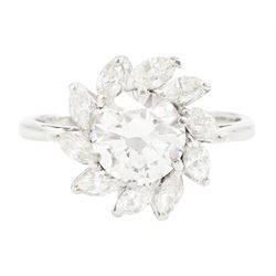 Platinum diamond cluster ring, the principal transitional cut diamond of approx 1.30 carat...