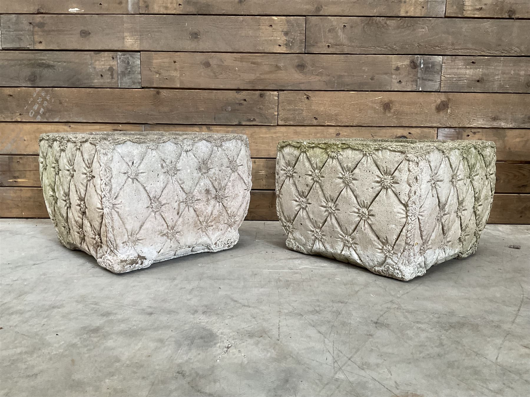 Pair of weathered cast stone square planters, daisy chain detail, one stamped