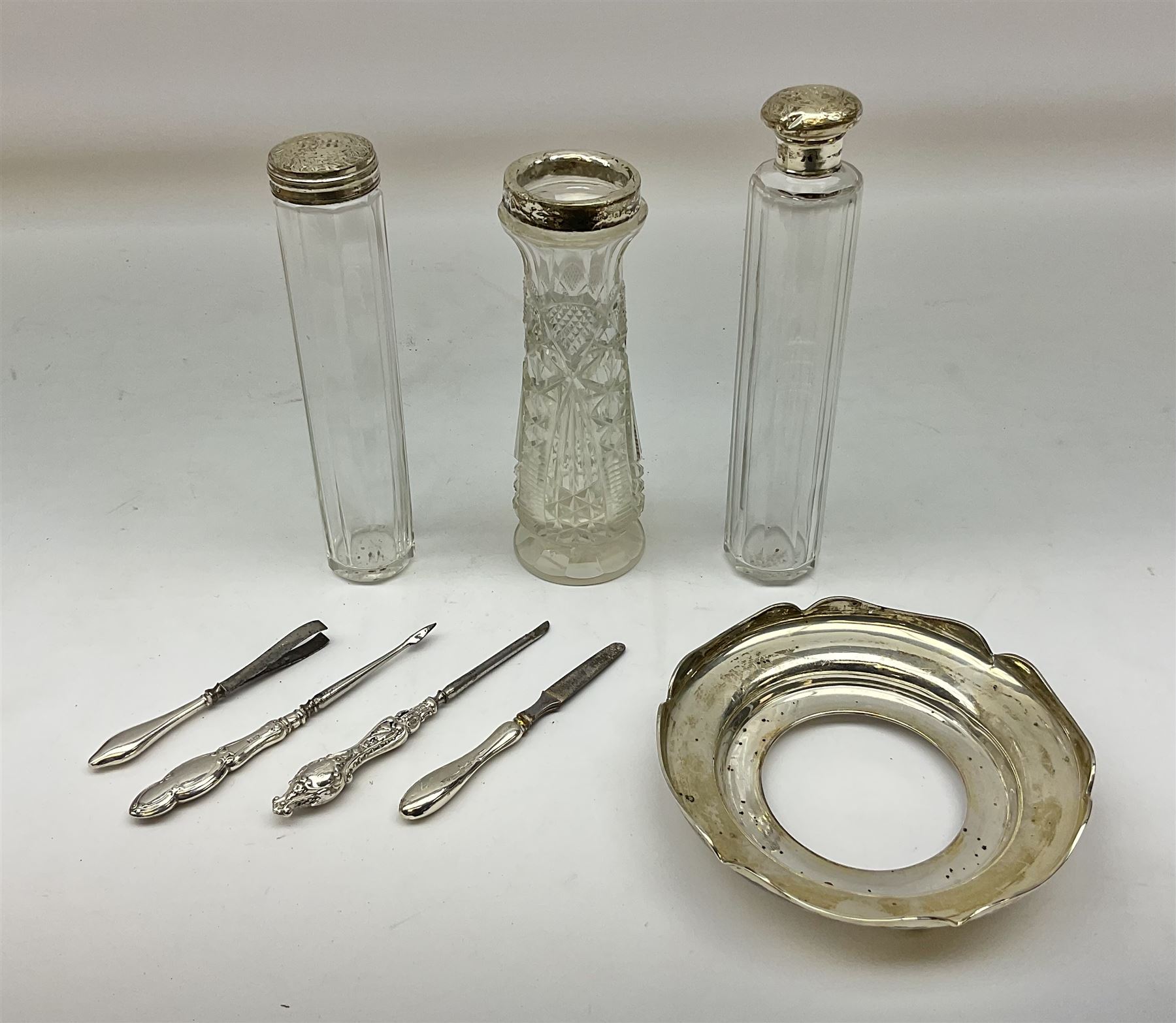 1920's silver stand, hallmarked Birmingham 1922, together with two tall faceted clear glass dressing table jars with hallmarked silver covers, and cut glass vase with hallmarked silver mounted collar, and small group of silver handled accessories, including files, picks, etc., approximate total silver weight 58.8 grams