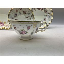 Coalport Revelry pattern tea and dinner wares, comprising nine dinner plates, four salad plates, eleven side plates, sauce boat and stand, ten teacups and ten saucers, and preserve pot and cover, together with a Coalport plate of shaped form decorated with pink roses, and a Royal Crown Derby Royal Antoinette pattern trio