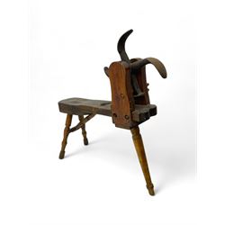 Early 19th century cobbler's work bench, in various woods, revolving cast iron last on yew wood supports, pine seat with inset maker's plaque inscribed 'No 7 Josh Blacker Harehills Leeds', on turned elm front supports and turned beech rear supports 