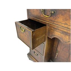 George III mahogany desk, fitted with eight oak lined drawers and centre recessed 'dog kennel' cupboard, quarter veneered top with inlaid banding, canted ribbed corners, plinth base raised on bun feet