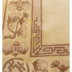 Late 20th century Chinese wool carpet, cream field with five stylized dragons arranged in a circular formation around a central flaming pearl motif, dragons depicted with elongated bodies and clawed feet amongst stylized cloud forms, enclosed within a narrow inner border and a wider outer border decorated with traditional Chinese motifs and symbols