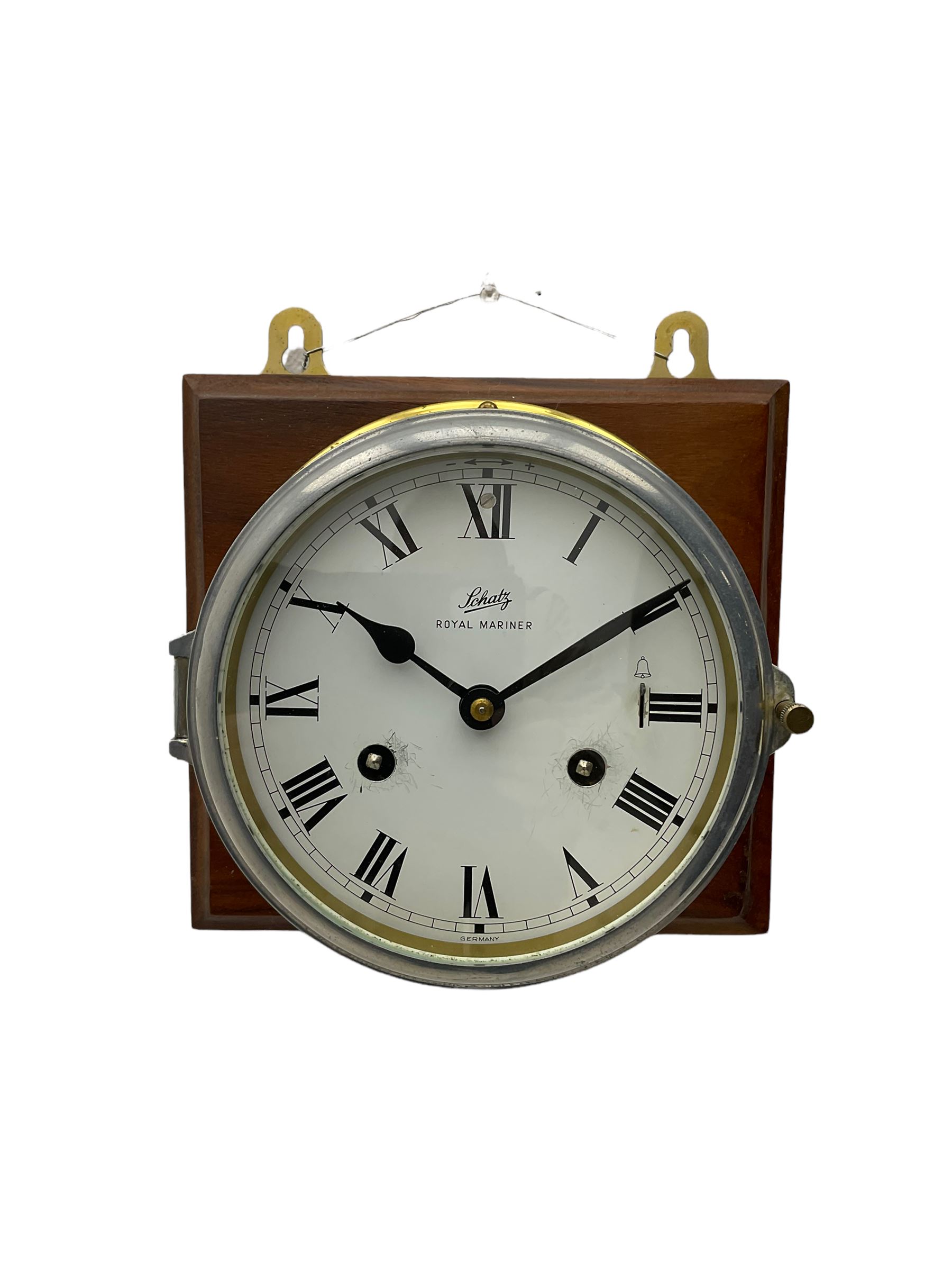 A compact German manufactured ships clock in a spun brass case with a 5