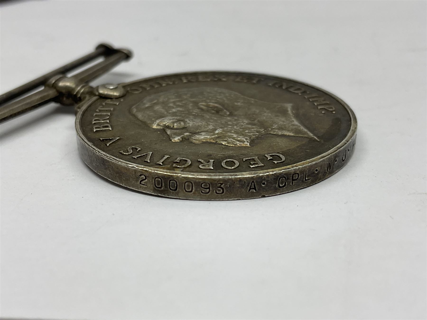 WW1 group of three medals comprising 1914-15 Star awarded to L-Cpl. W.J. Horspool R.War.R., British War Medal and Victory Medal awarded to A. Cpl. W.J. Horspool R.War.R.; WW1 British War Medal awarded to 3-8755 W.O.Cl.2. S. Paterson North'd Fus.; and hallmarked silver and enamel Northumberland Football Association Junior Cup Runners Up fob 1921-22 on silver chain (5)