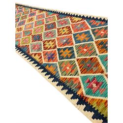 Anatolian Turkish Kilim ivory ground runner rug, decorated with all over multi-colour geometric lozenges with ivory outline