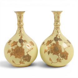 Pair of Royal Crown Derby bud vases, decorated with gilt floral sprigs upon a yellow groun...