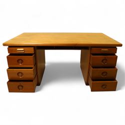 Mid 20th century teak twin pedestal partners desk, rectangular top with rounded corners with integral frieze storage shelf, above  pedestals each fitted with three drawers, recessed circular pull handles, cupboard doors fitted to the opposing side on concealed plinth bases