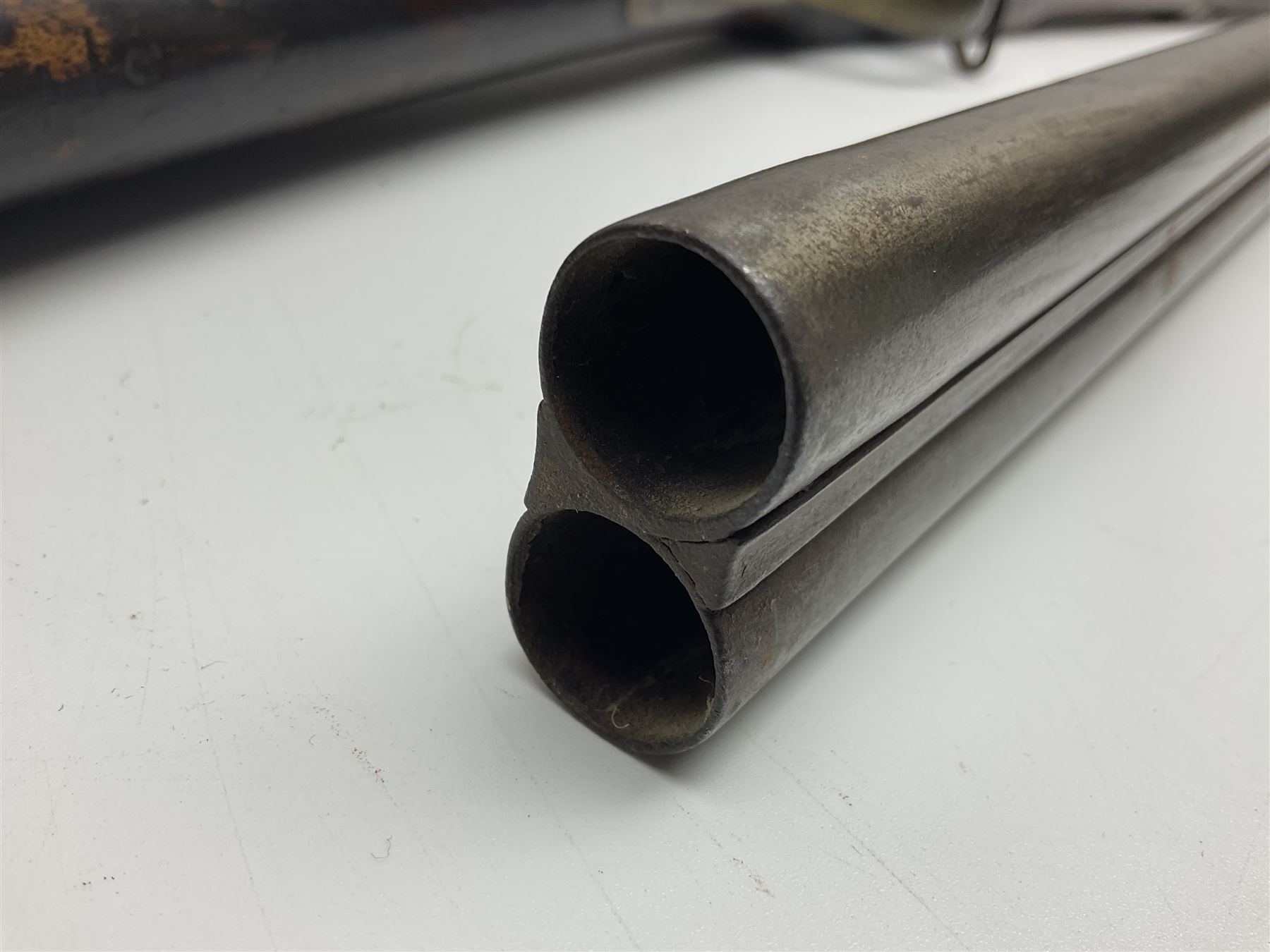 19th century Indian .577 Enfield muzzle loading rifle, proofed for 26-bore, the 98.5cm barrel with three barrel bands and later ram rod L140cm overall; 19th century Belgian side-by-side double barrel percussion shotgun, approximately 20-bore, with 74cm barrels and studded walnut stock, lock plate marked 'Liege 1868' and 'V. Gulikers-Maquinay' L117cm overall; and another side-by-side double barrel shotgun by Smythe with underlever opening (3)