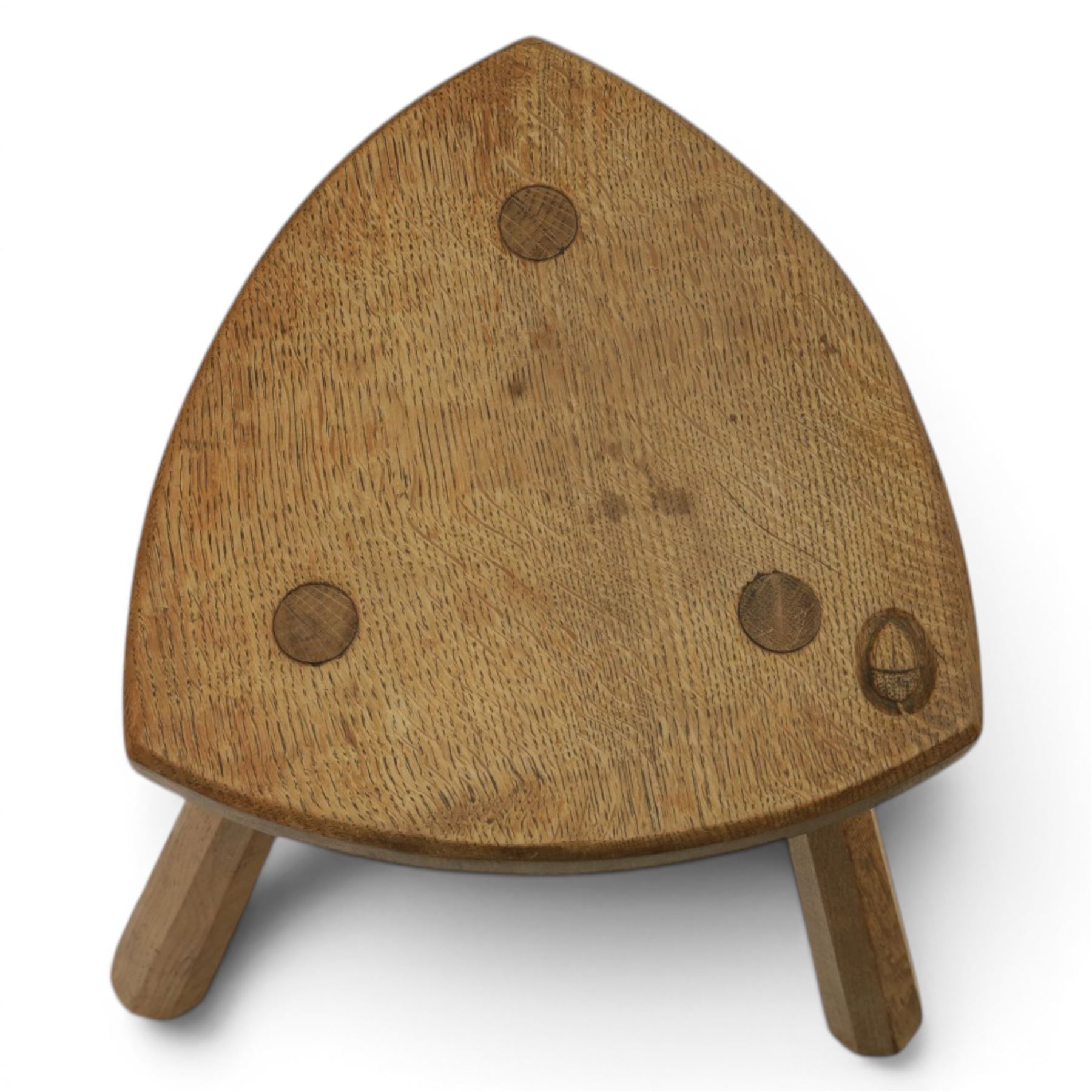 Acornman - oak milking stool, with signature acorn carving by the workshop of Alan Grainger of Brandsby