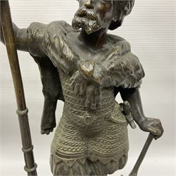 Pair of bronzed figure modelled as a hunter in traditional dress, each holding a pike, H48cm