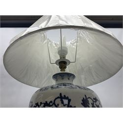 Table lamp of tapering form, decorated with stylised flowers, upon a footed circular base, with shade H70cm