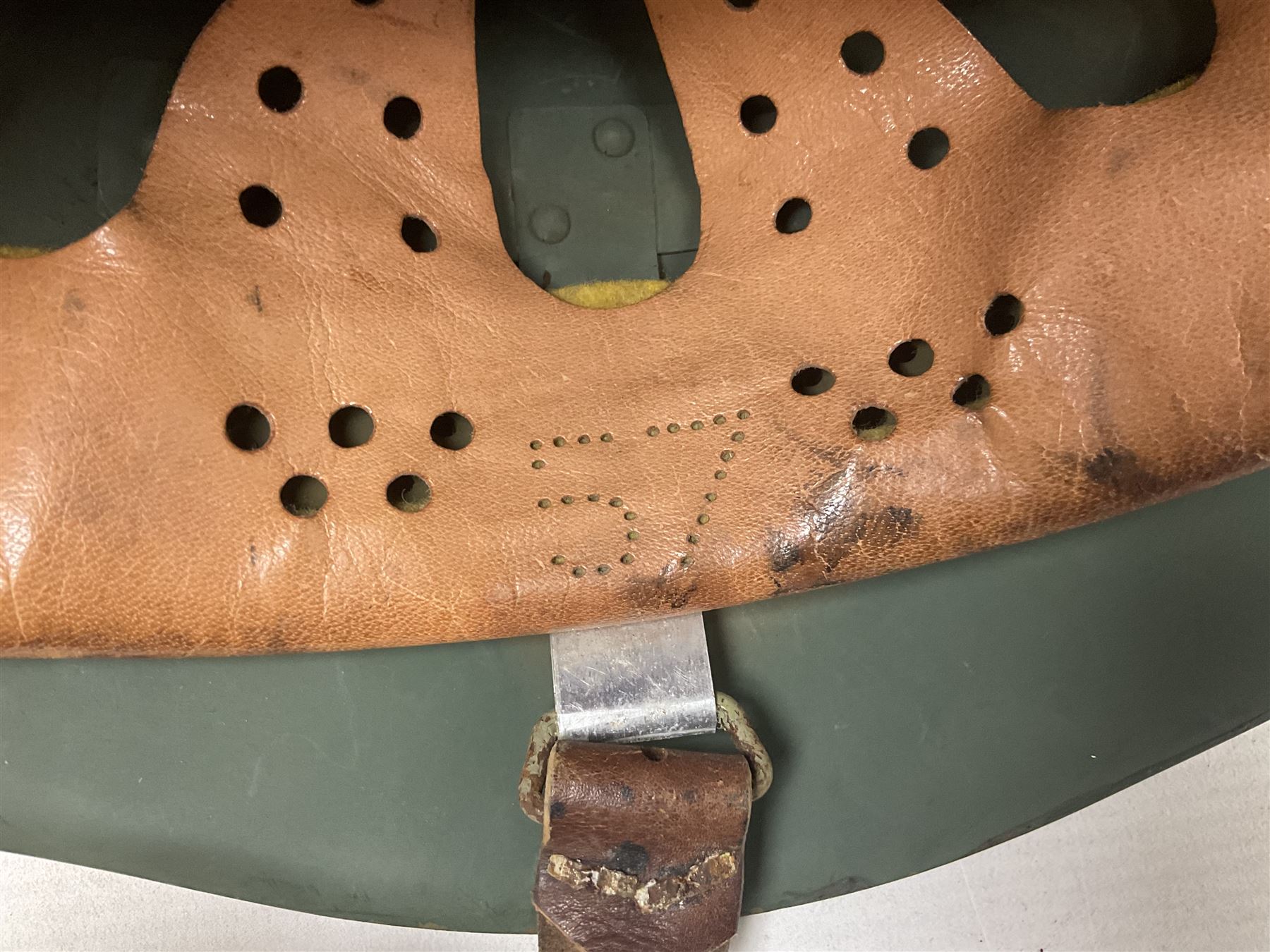 1960s Italian parachutist helmet with liner; camouflage paintwork with parachutist crest to the front