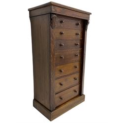 Victorian oak Wellington chest, fitted with seven drawers, lockable hinged side return