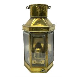 WW1 period ship's brass cased bulkhead lantern by Player & Mitchell Birmingham of half-octagonal form with original removable Bulpitt oil burner and hanging bracket verso H40cm