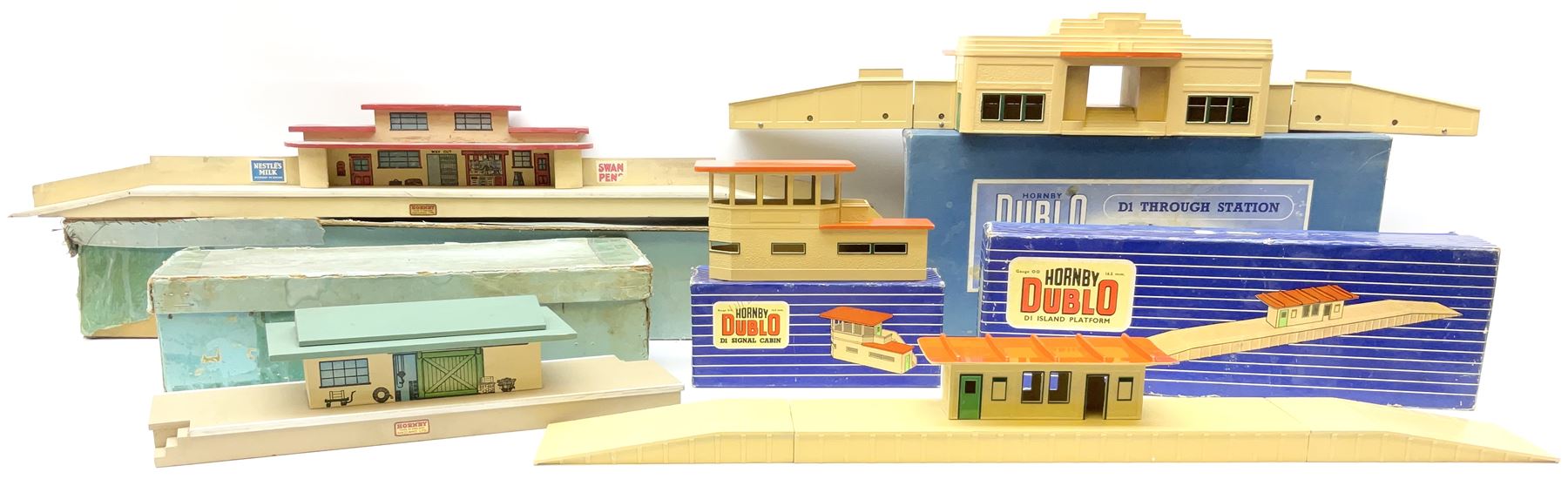 Hornby Dublo - wooden D1 Main Line Station and D1 Goods Depot, both in pale blue boxes; die-cast D1 Through Station in plain blue box; die-cast D1 Island Platform and D1 Signal Cabin, both in blue striped boxes (5)