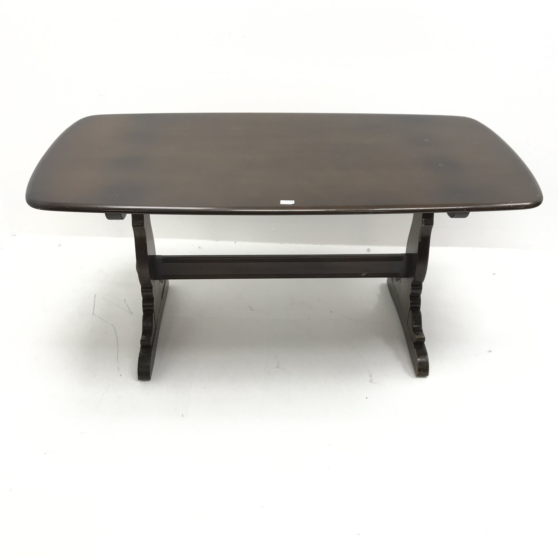 Ercol Old Colonial elm refectory table, two shaped supports joined by