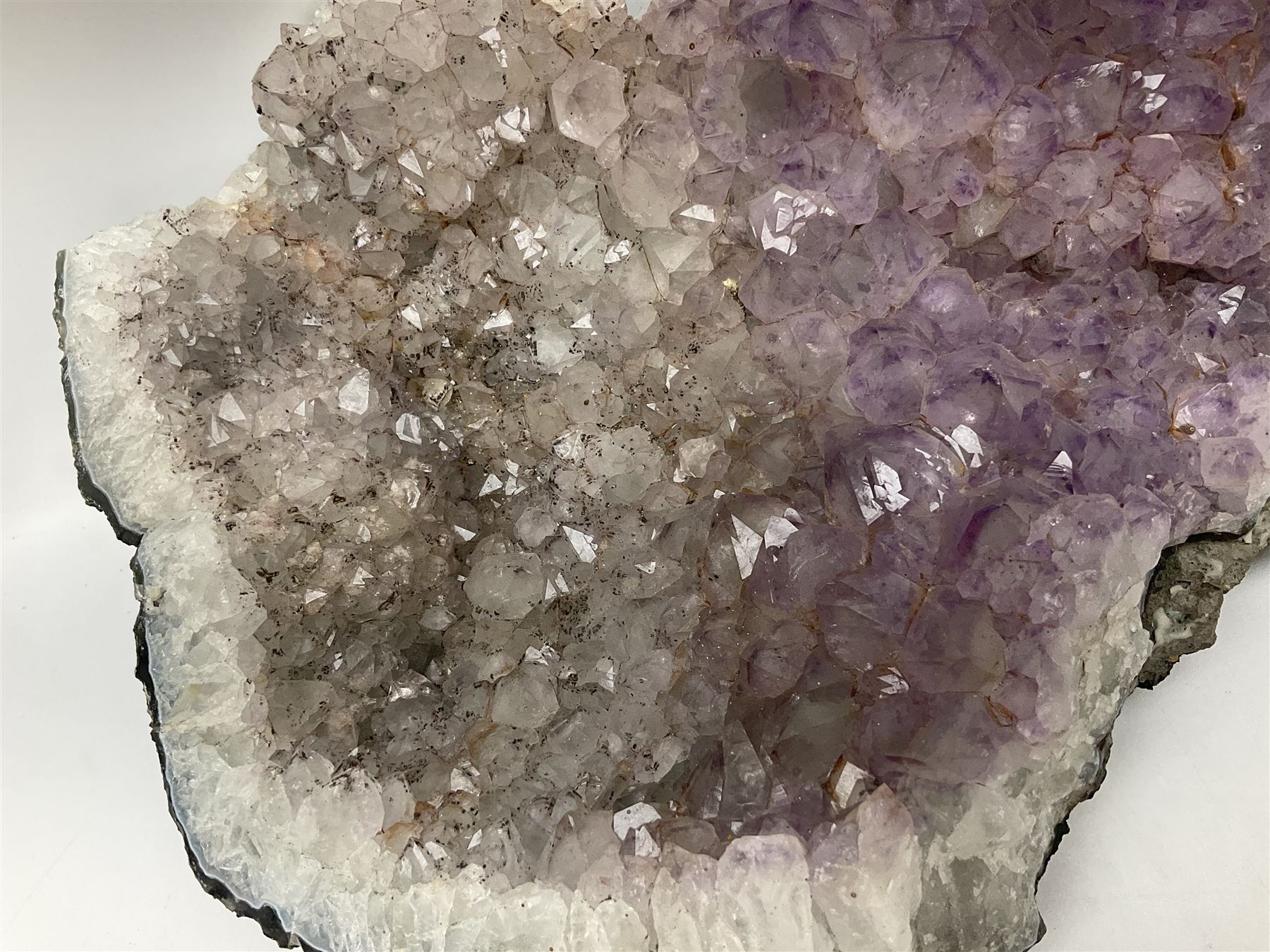 Amethyst crystal geode cluster, with well-defined crystals of various sizes, H13cm, L46cm