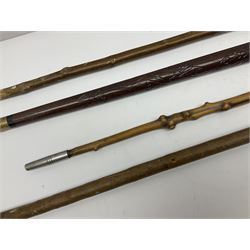 Four wooden walking canes, including a carved mahogany snooker cue example, tallest H86cm