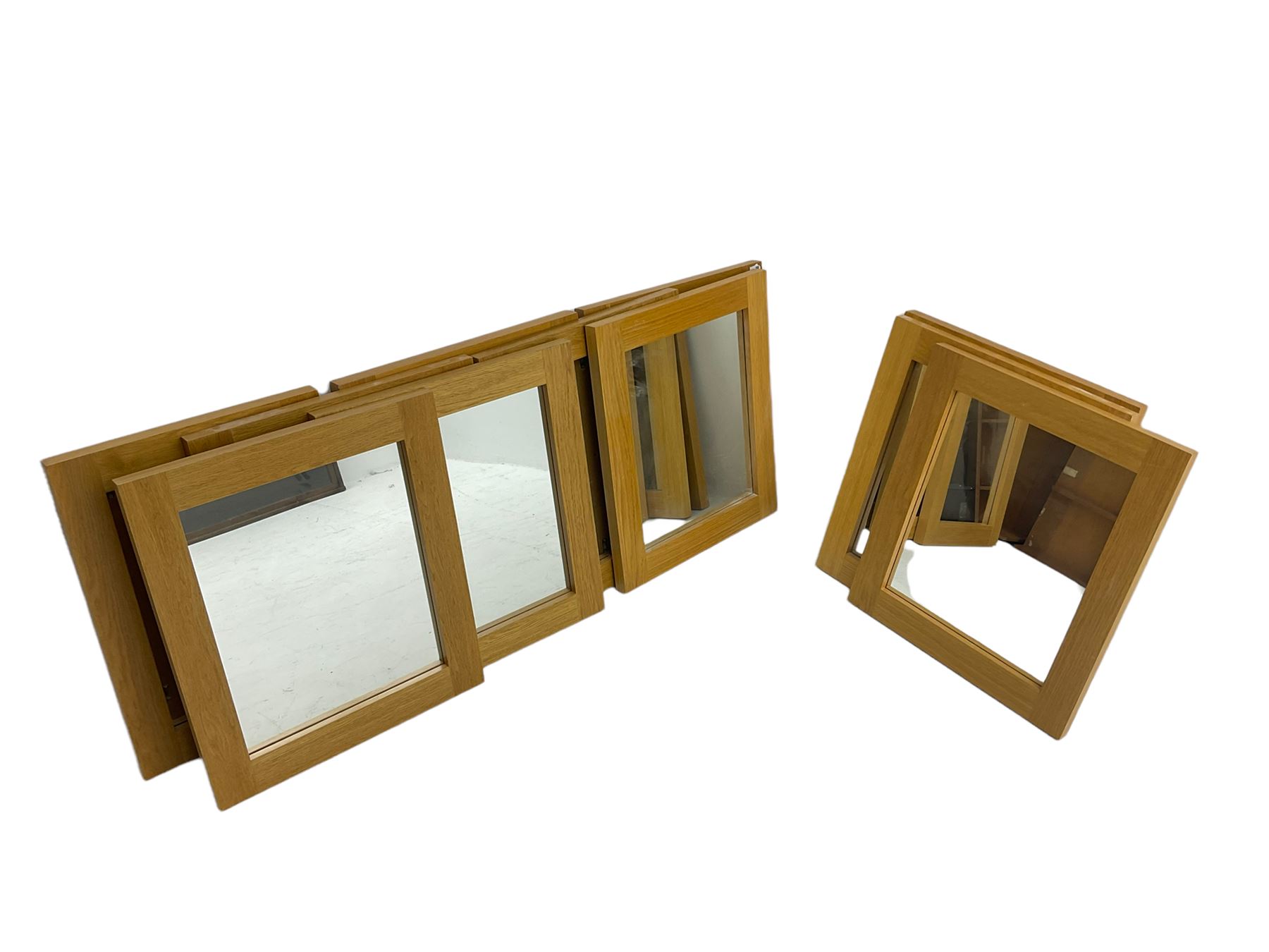 Ten oak framed rectangular mirrors, and a smaller oak framed mirror