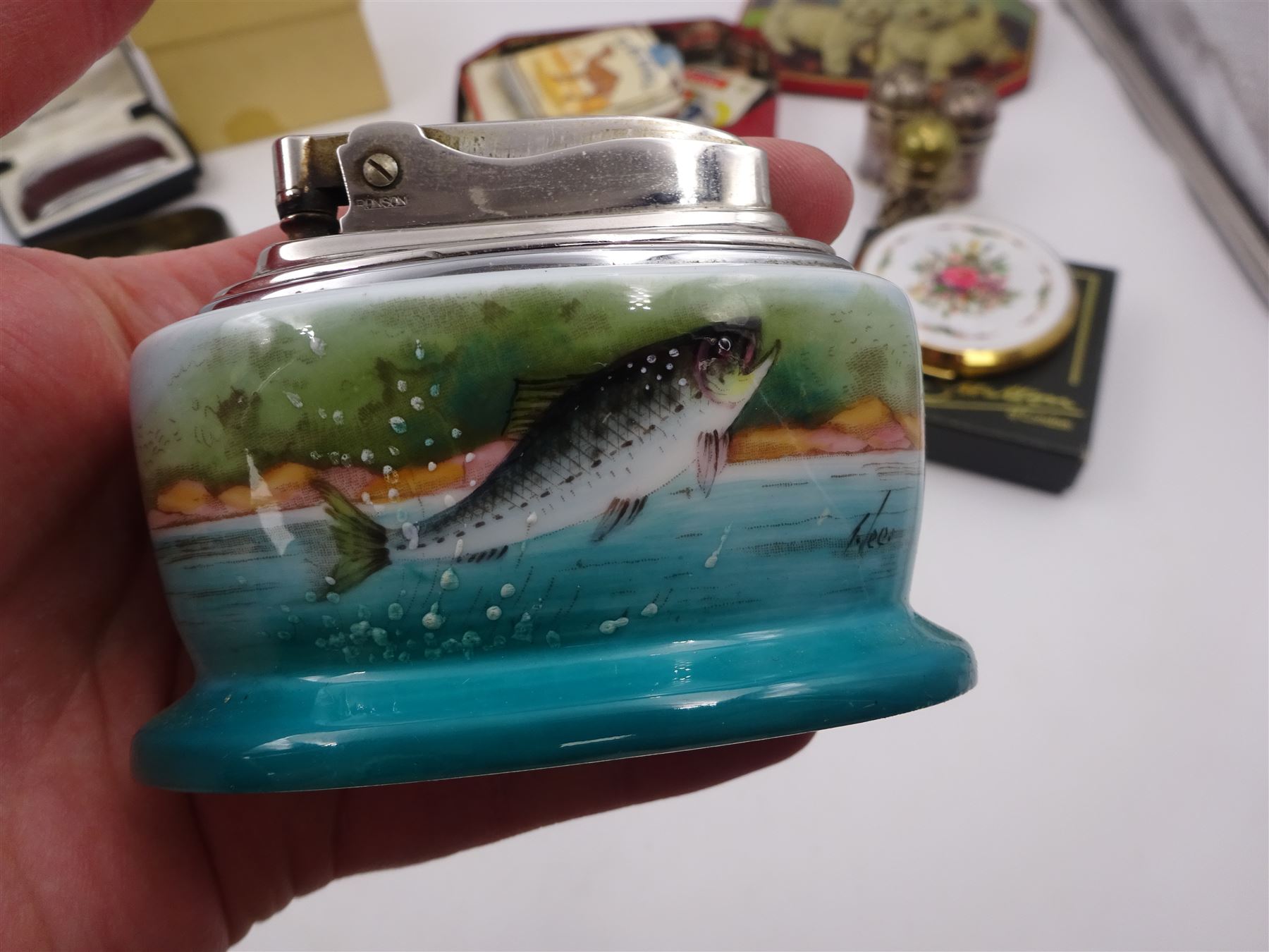 Minton table lighter decorated with a leaping salmon, signed T.Lee, with Ronson lighter mechanism, boxed, together with a Ronson Varaflame lighter, Stratton compact mirror, collection of Wade whimsies and a miniature Gemma teaset