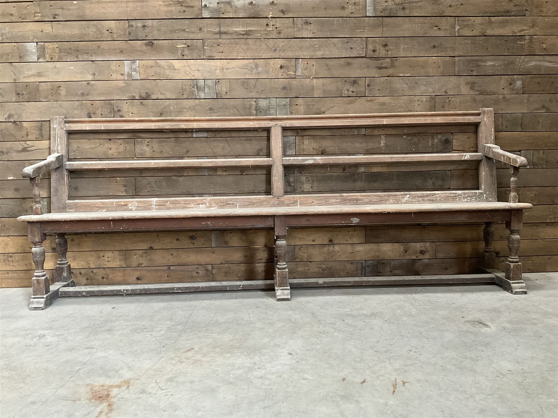 Victorian pitch pine bench pew, turned arms and legs, rail back with plank seat, 249cm