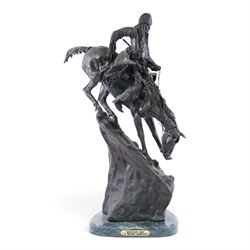 After Frederick Remington; The Mountain Man bronzed spelter figure of a native American tr...