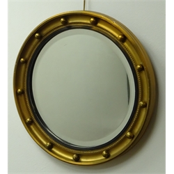  Regency style gilt framed convex wall mirror with ball surround and  reeded ebonised, D45cm  