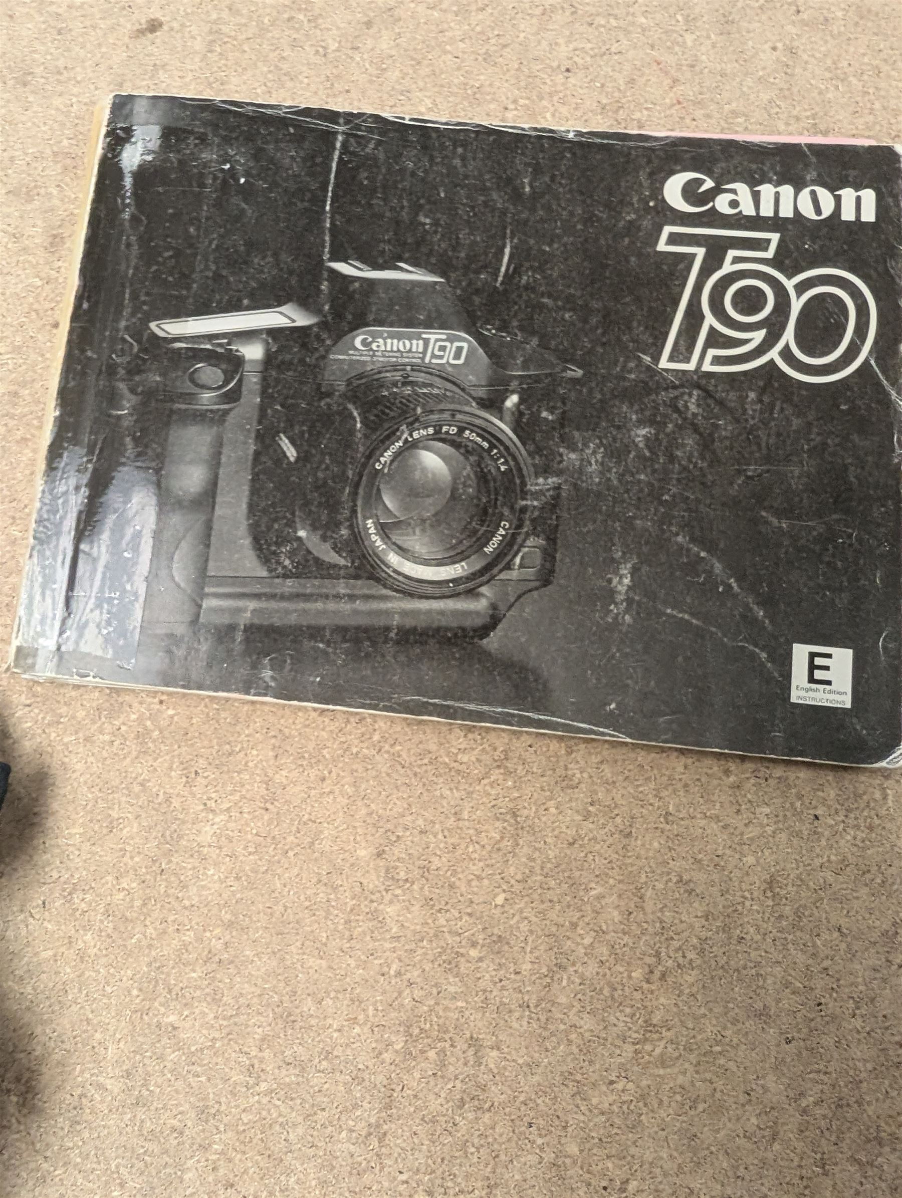 Canon T90 camera and a Kodak EK 160-EF camera