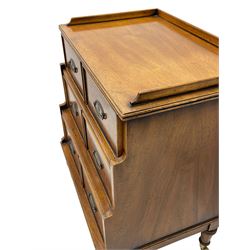Small Georgian design walnut waterfall correspondence chest, the reed moulded top with raised back, fitted with three drawers each disguised as two small drawers, the interiors with sloping divisions, on turned feet with brass cups and castors