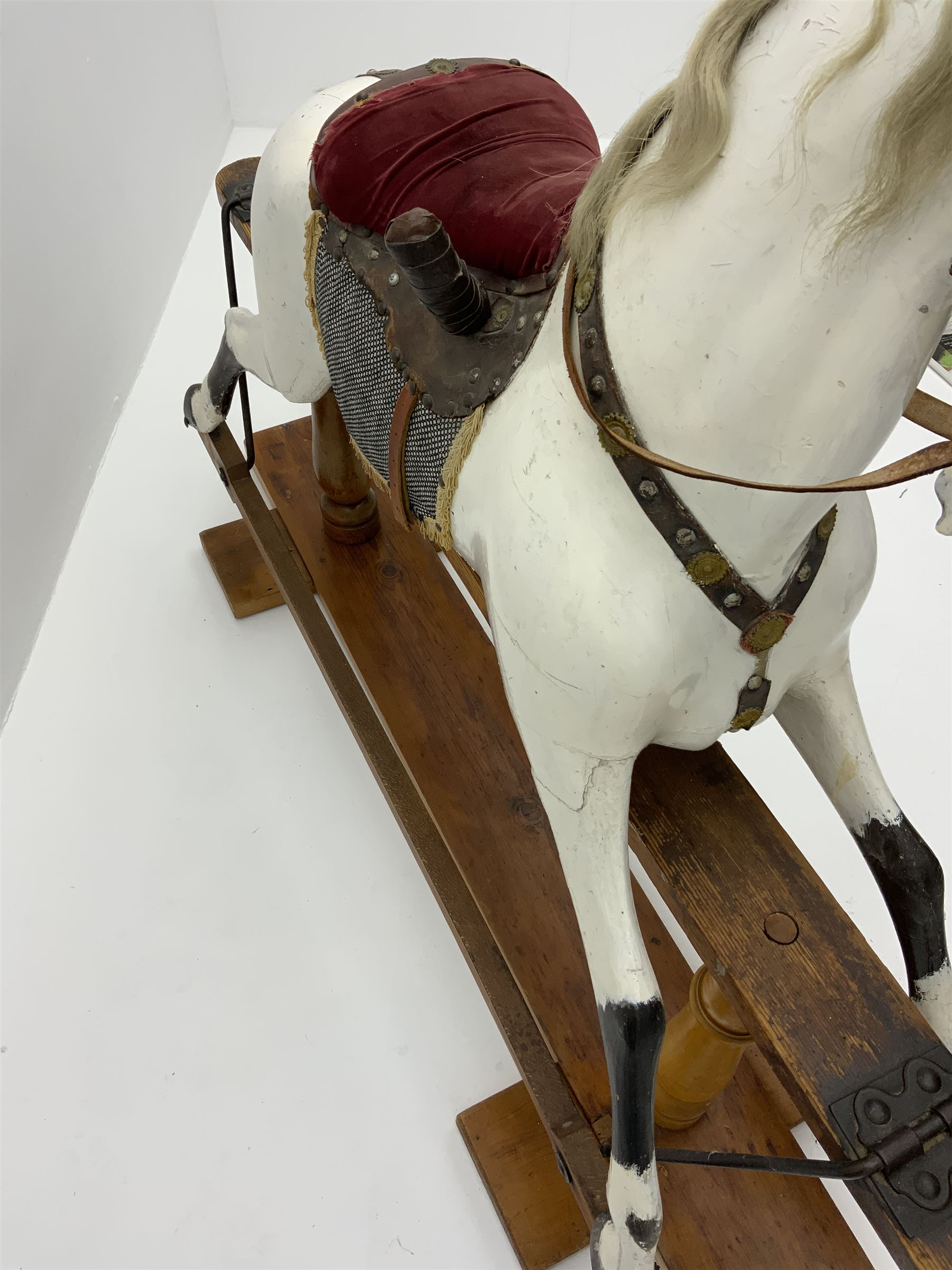 Victorian white finished rocking horse, complete with studded saddle and bridle, brass stirrups