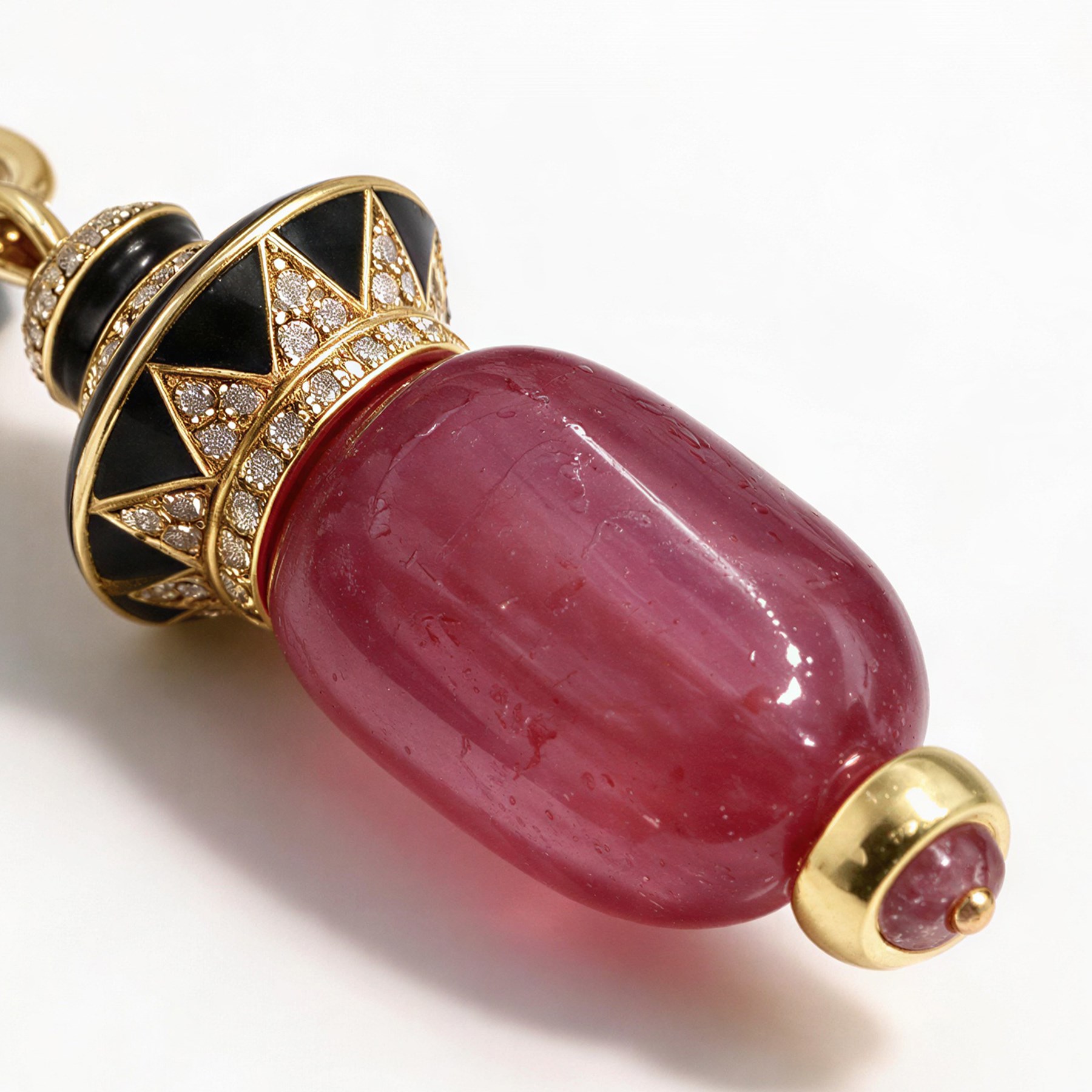 18ct gold ruby diamond and black enamel pedant, set with a single cabochon cut ruby, suspending from a diamond and enamel pendant and a diamond set bail
