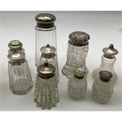 Group of silver mounted glass bottles and open salts, a number with octagonal and hobnail cut decoration, various hallmarks, mostly London and Birmingham. 
