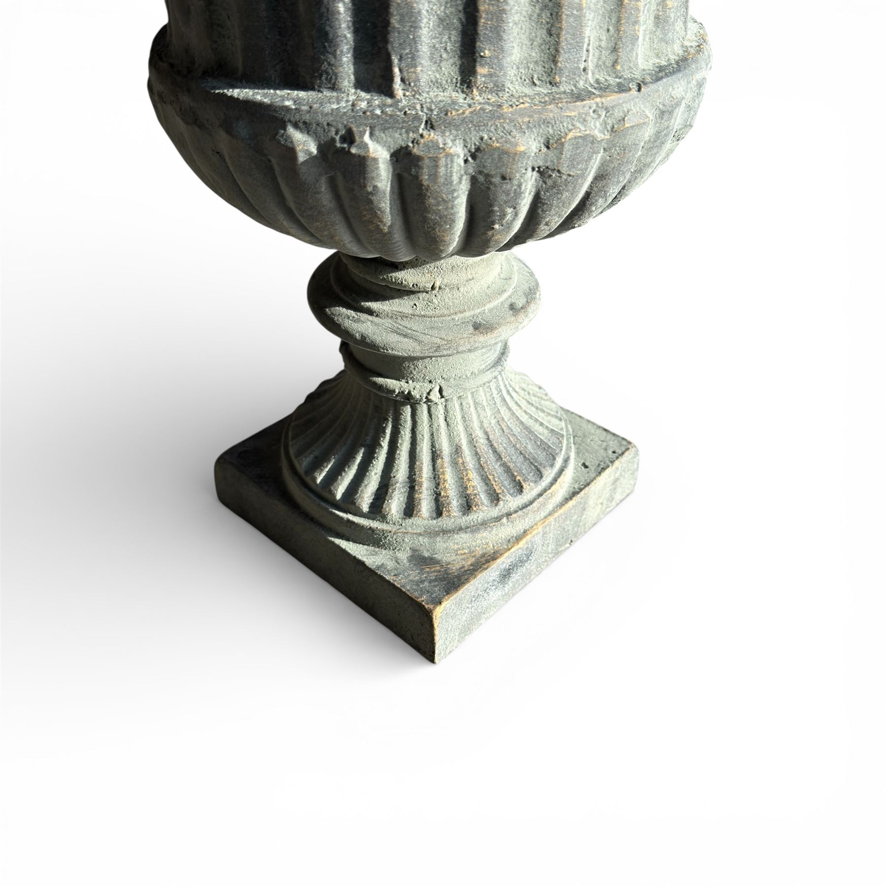 Pair of cast iron Urns on square bases