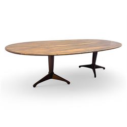 Andrew Milne for Heals - mid-20th century extending dining or boardroom table, oval top with one additional leaf, raised on twin tapering pedestal supports terminating in tripod feet