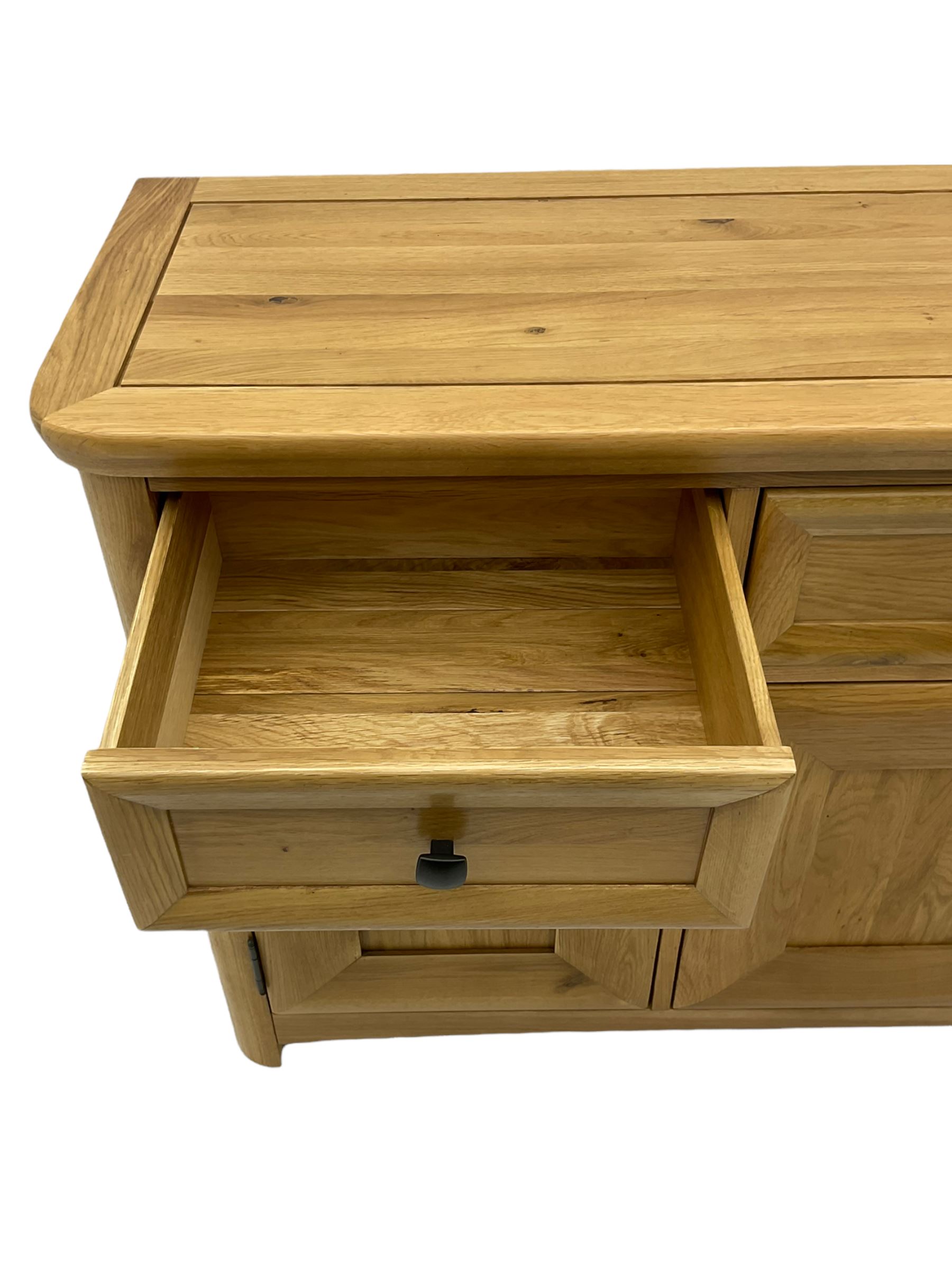 Solid light oak sideboard, fitted with three drawers and three