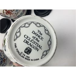 Franklin Mint Chinese style ceramics, comprising two vases, puppy and a planter, all on wooden stands