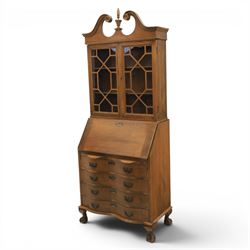 Maddox of Jamestown New York - Georgian design mahogany bureau bookcase, broken arch pediment with central finial, astragal glazed bookcase, above a fall front writing slope with fitted interior, four serpentine drawers, raised on claw on ball feet 