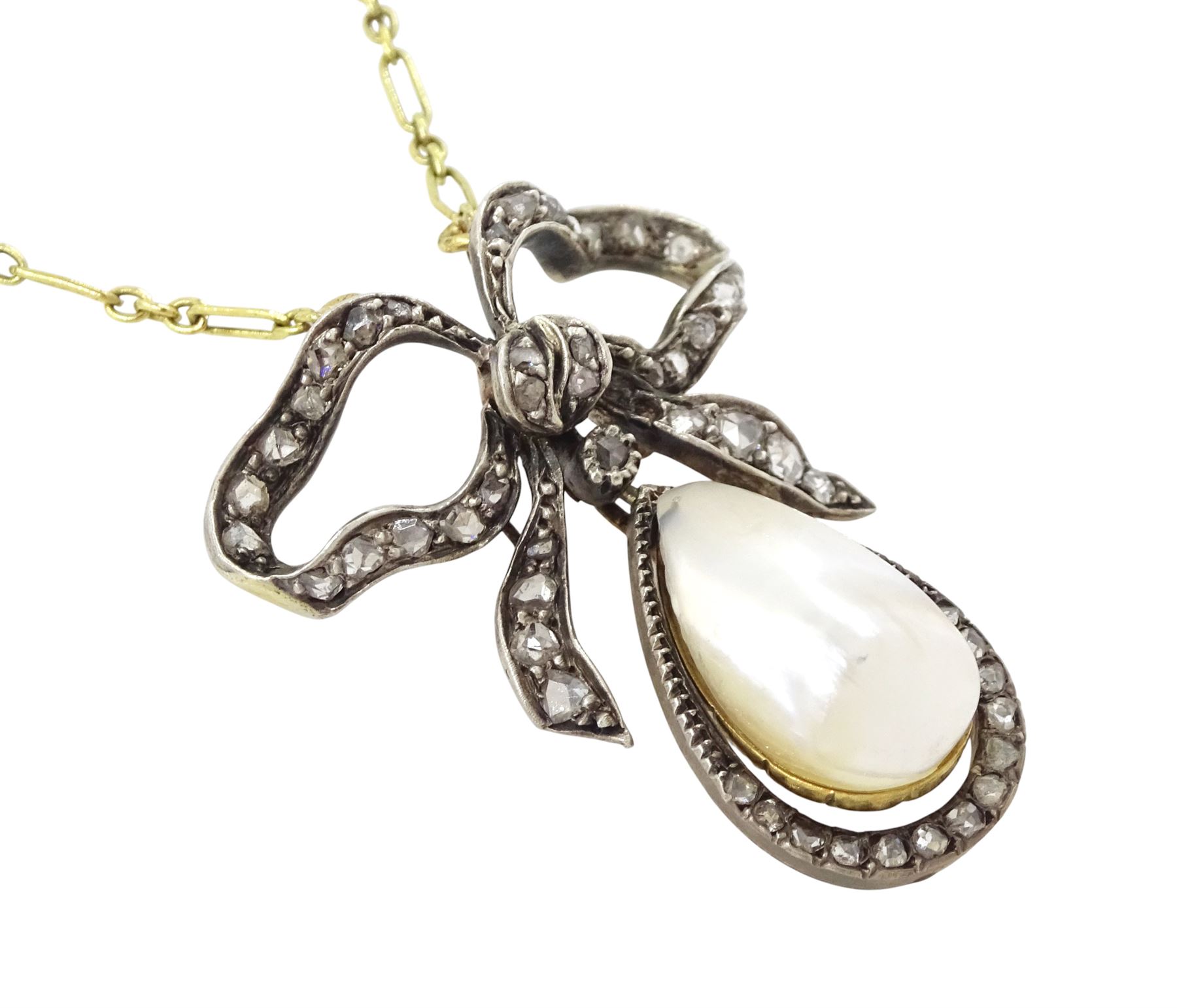 French early 20th century gold and silver pearl and diamond bow pendant, pear shaped blister pearl with old cut and rose cut diamond surround, suspending from a diamond set bow, to an 18ct gold fancy link chain necklace