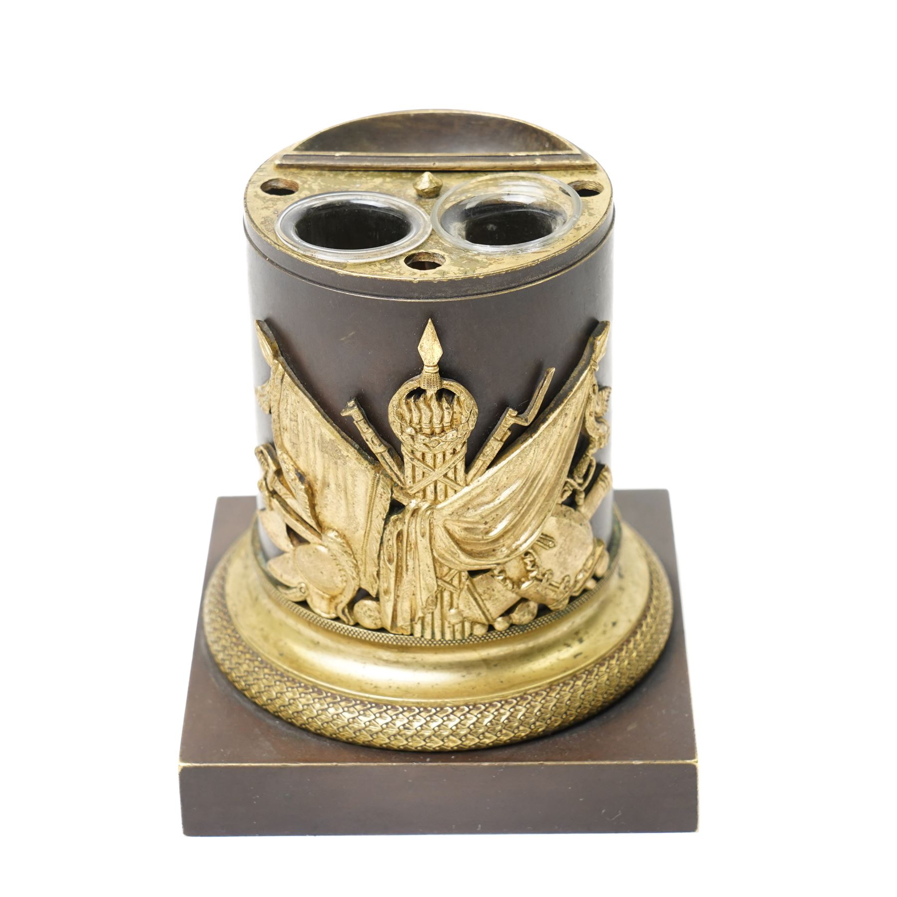 French 19th-century bronze inkwell surmounted by a bust of General Maximilien-Sébastien Foy, the cylindrical column applied with gilt-metal martial trophies and a classical caduceus of Hermes, emblematic of eloquence, commerce and diplomacy, raised on a brass socle cast with a scale pattern, on a square bronze base, the interior fitted with two glass inkwells and bronze pounce pot, H19cm